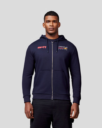 Front view of a man in a navy Checo Race Car zip hoodie with SP11 on the chest and Oracle Red Bull Racing branding