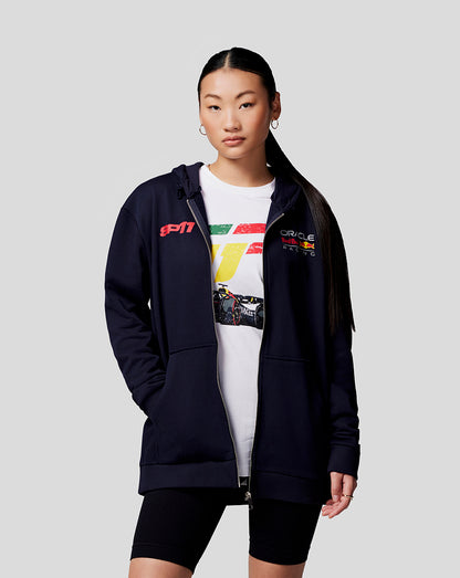 Model wearing navy Zip Hoodie over a graphic white tee bold multicolor back racing graphic on the hoodie