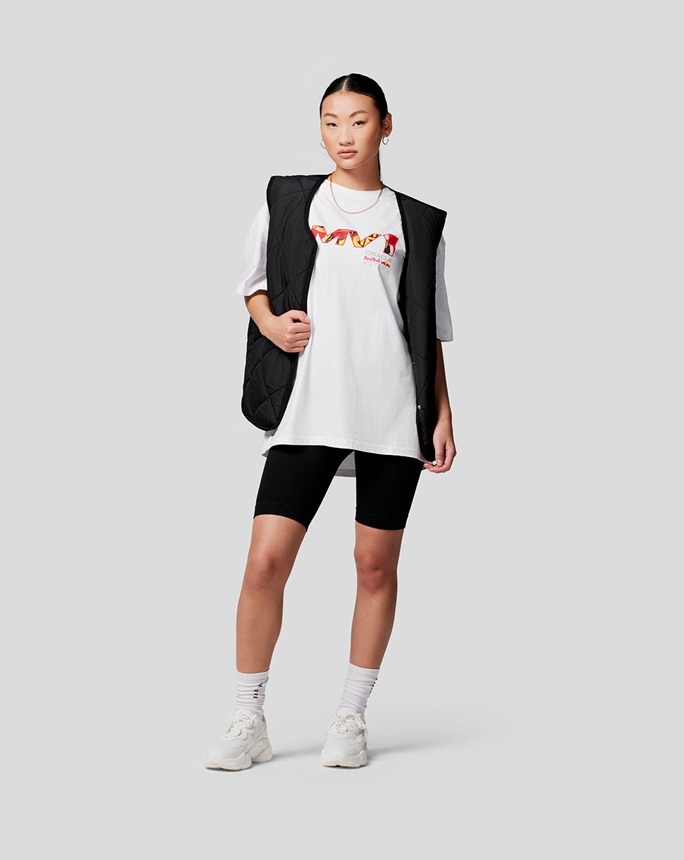 Model wearing bright white oversized Max Pop Art Tee with a colorful graphic on the front and back.