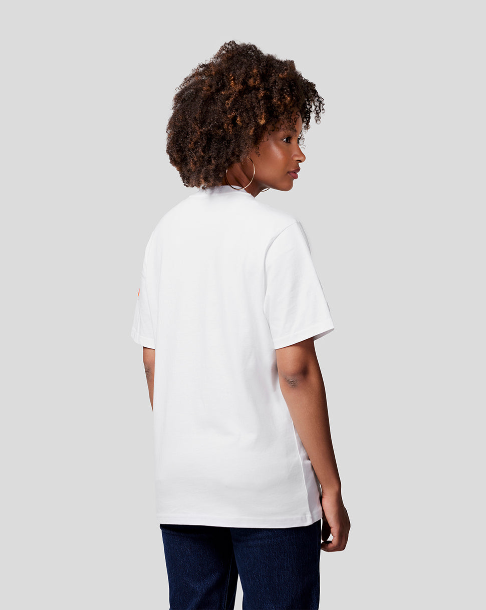 Back view of a woman wearing a white Max Expression Tee