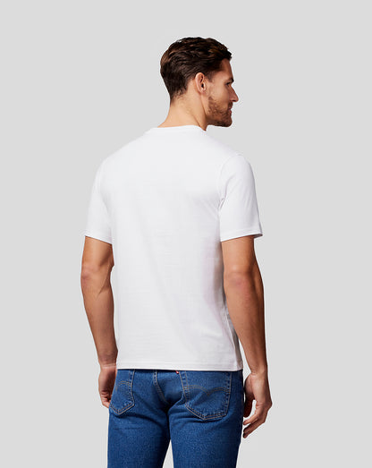 Back view of a man wearing a white Max Expression Tee
