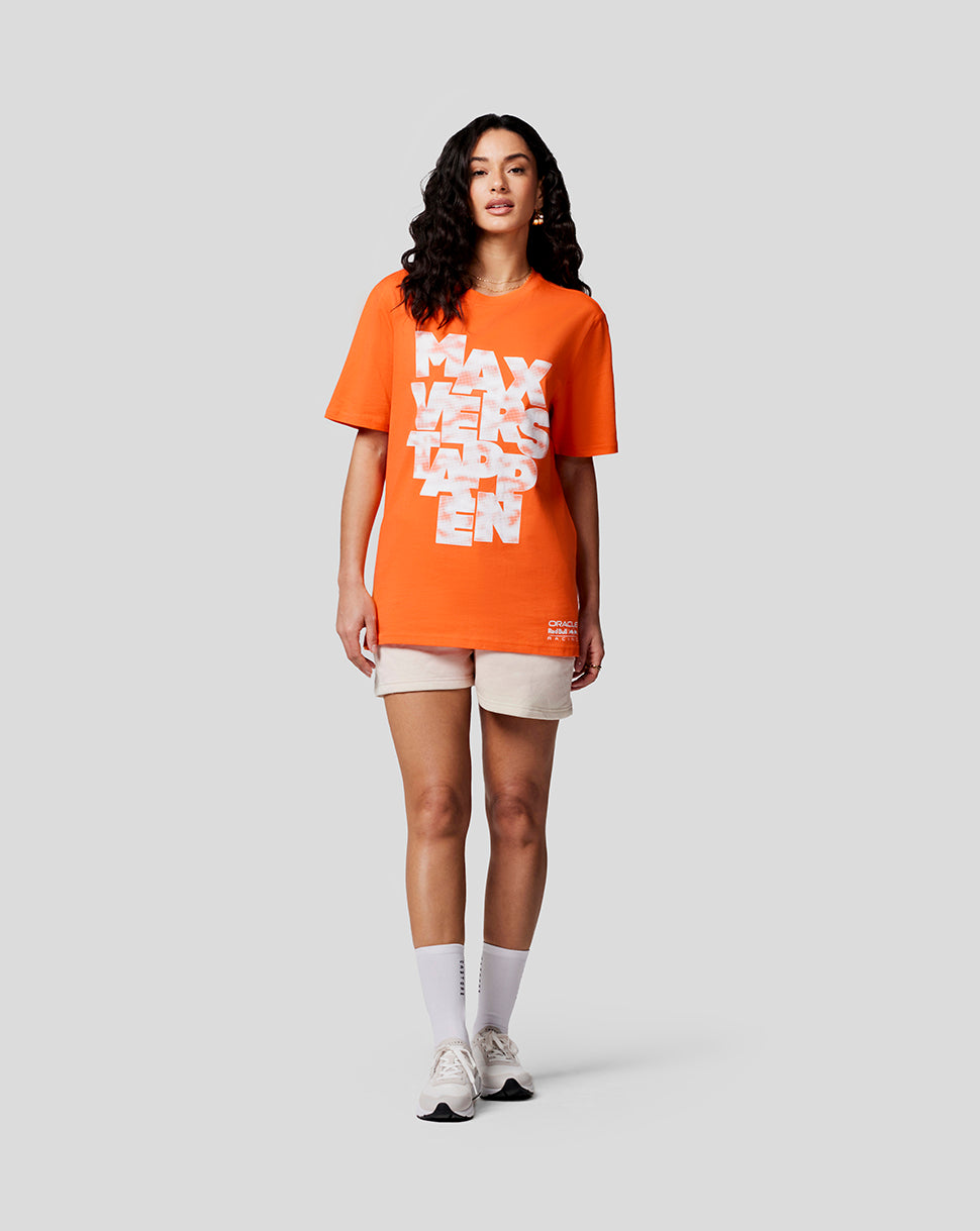 Female model in a bright orange Max Expression T shirt with a bold white Max Verstappen graphic on the front.