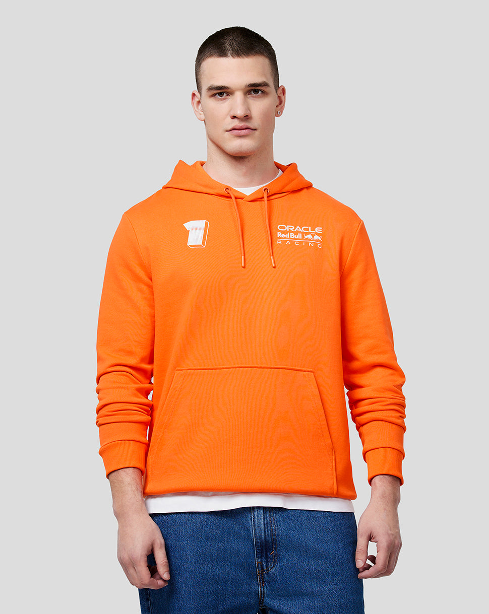 Male model in bright orange hoodie with drawstring hood and white branding on the chest