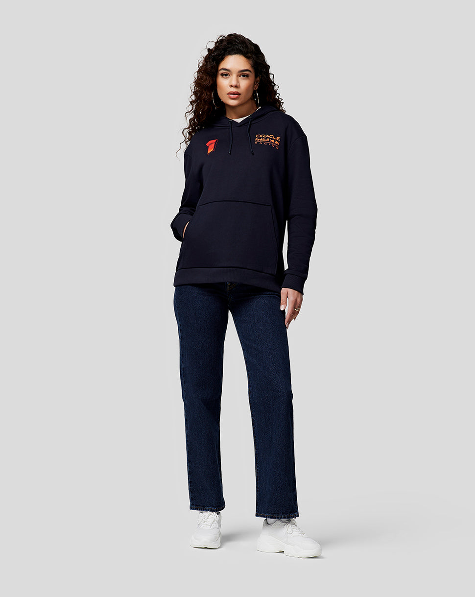 Front view of a female model in a navy Oracle Red Bull Racing hoodie with orange chest branding and a red patch.