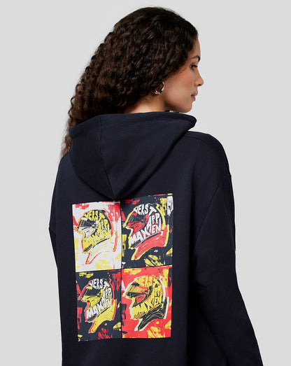 Side profile of a person wearing a navy oversized hoodie showing the back graphic of four pop art panels