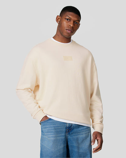 Unisex ecru oversized crew neck sweatshirt with subtle RBR chest patch logo