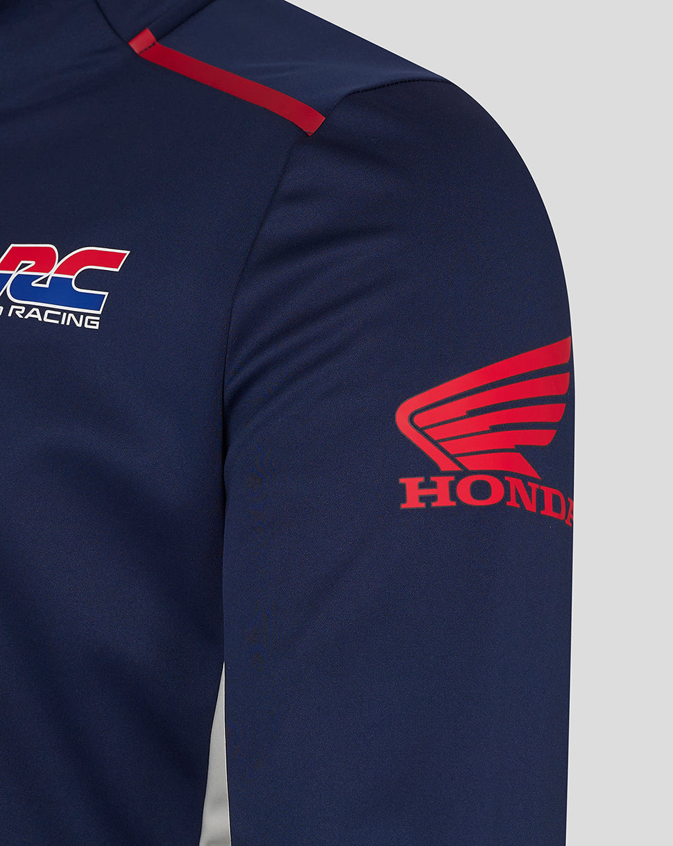Close up of navy Honda Racing softshell jacket showing HRC logo on the chest and red Honda wing emblem on the sleeve