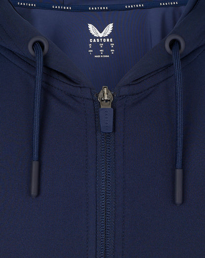 Close up of navy zip hoodie showing hood drawcords and front zipper with Castore branding on the interior label