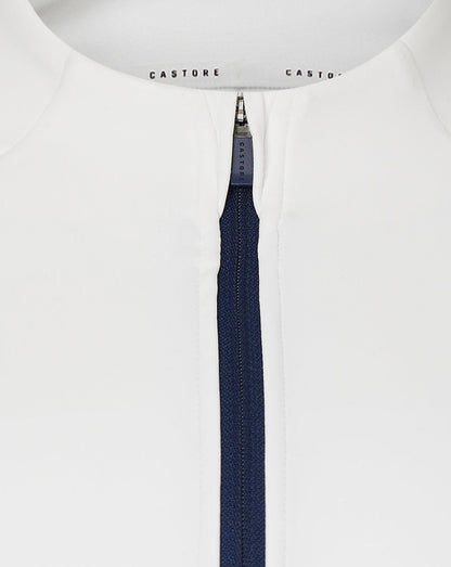 Close up of white quarter zip neck with navy zipper and Castore branding on collar tape.