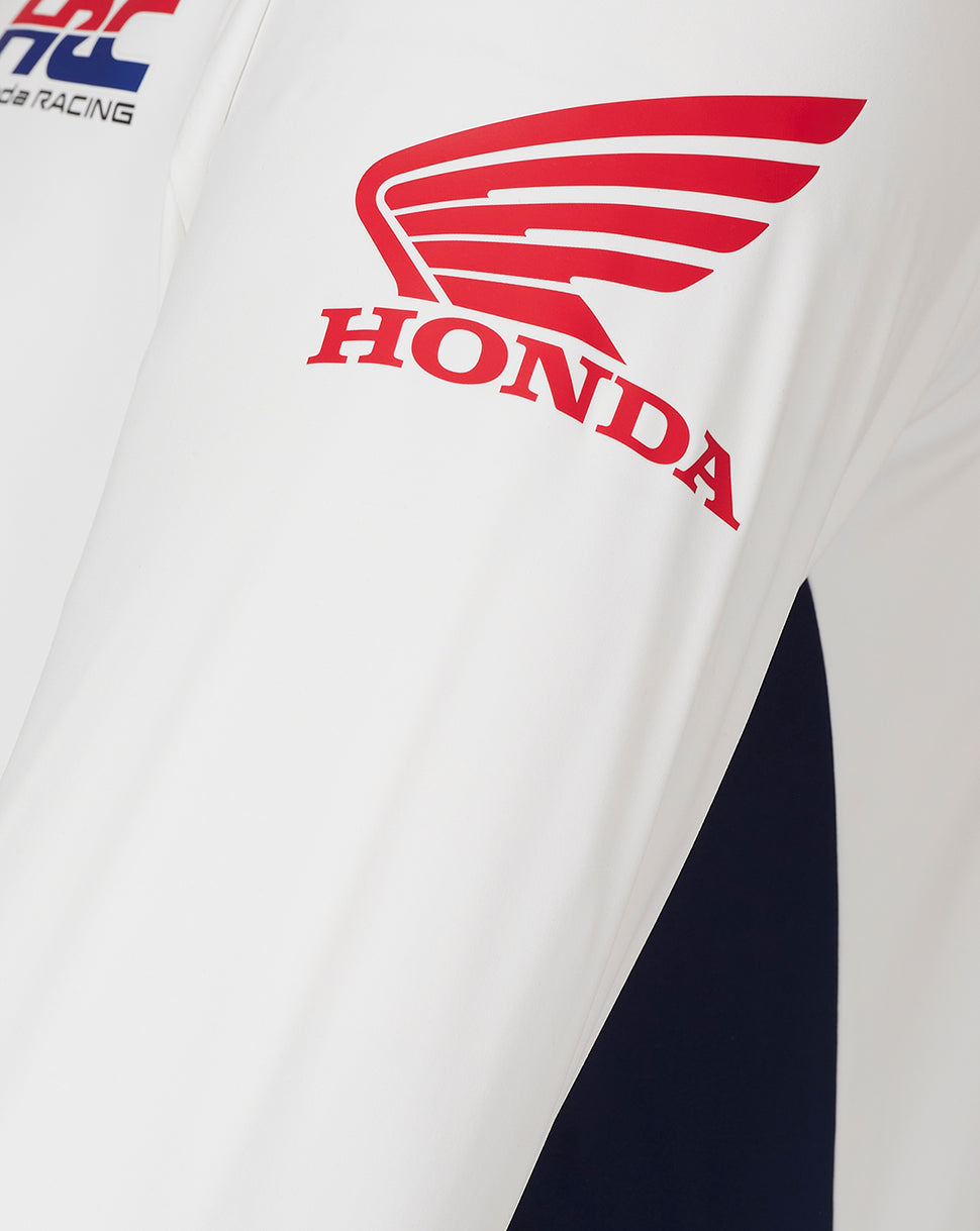 Close up of white sleeve area with red Honda wing logo and partial Honda branding.
