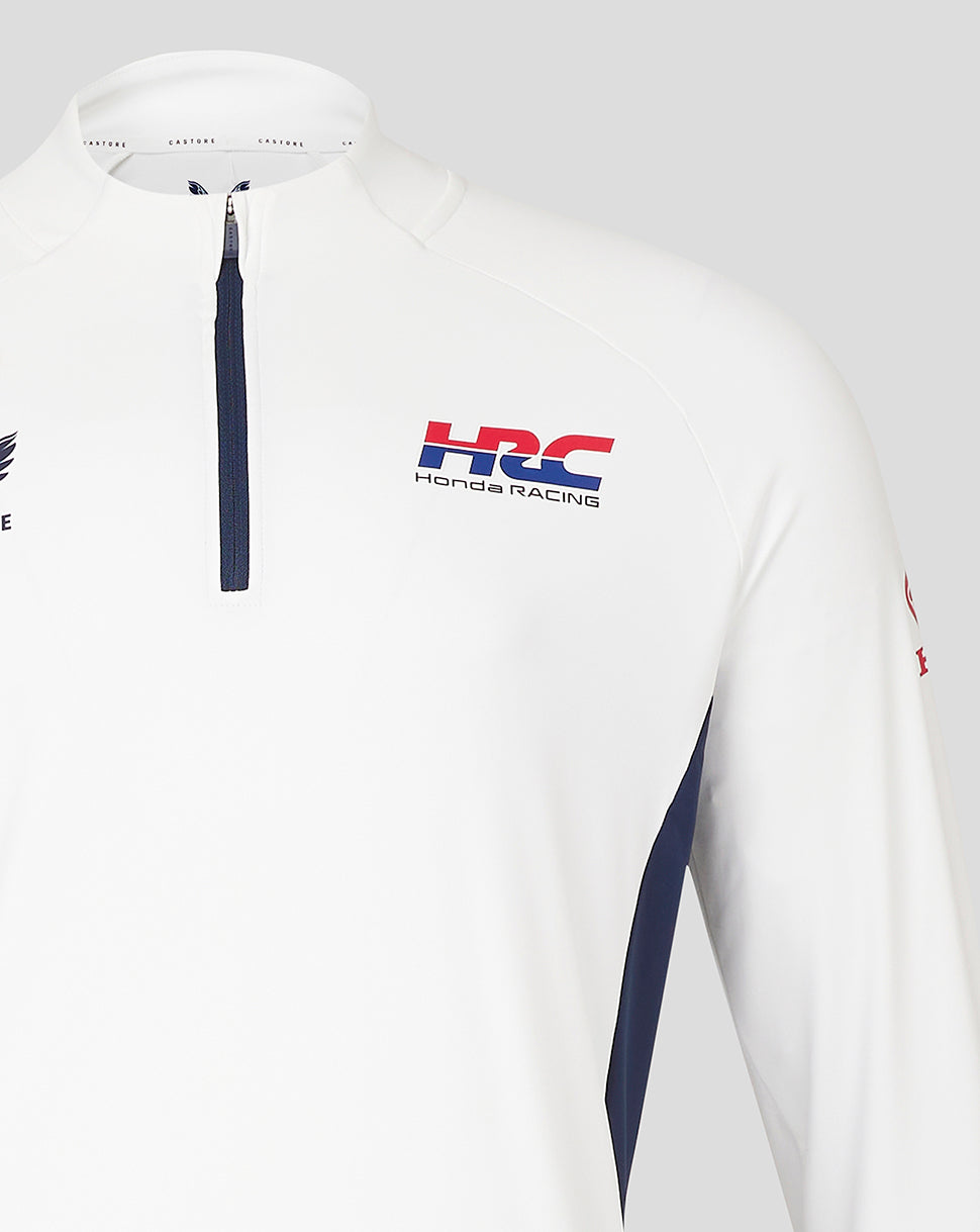 White Honda Racing quarter zip top shown from the front with HRC and Honda Racing branding on the chest and a navy front center zip