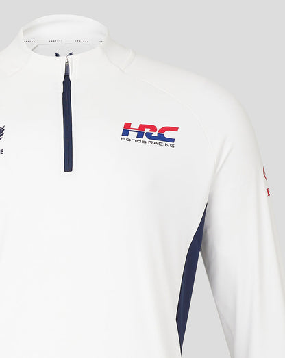 White Honda Racing quarter zip top shown from the front with HRC and Honda Racing branding on the chest and a navy front center zip