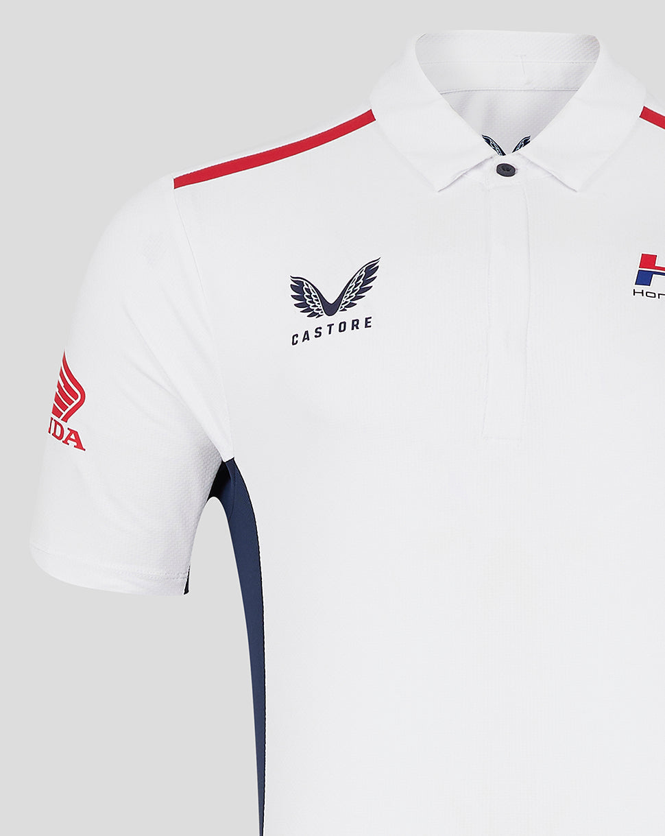 White unisex Honda HRC polo with red shoulder stripe and navy side panels, Castore branding on chest and Honda Repsol logos