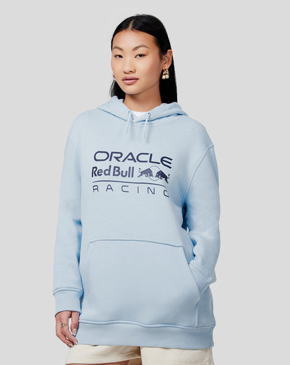 Front view of a woman in a light blue Oracle Red Bull Racing hoodie with kangaroo pocket and logo