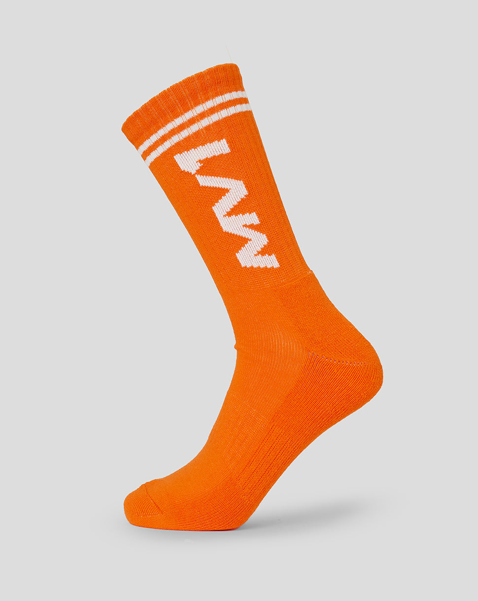 Exotic orange unisex driver sock with white cuff stripes and MV branding
