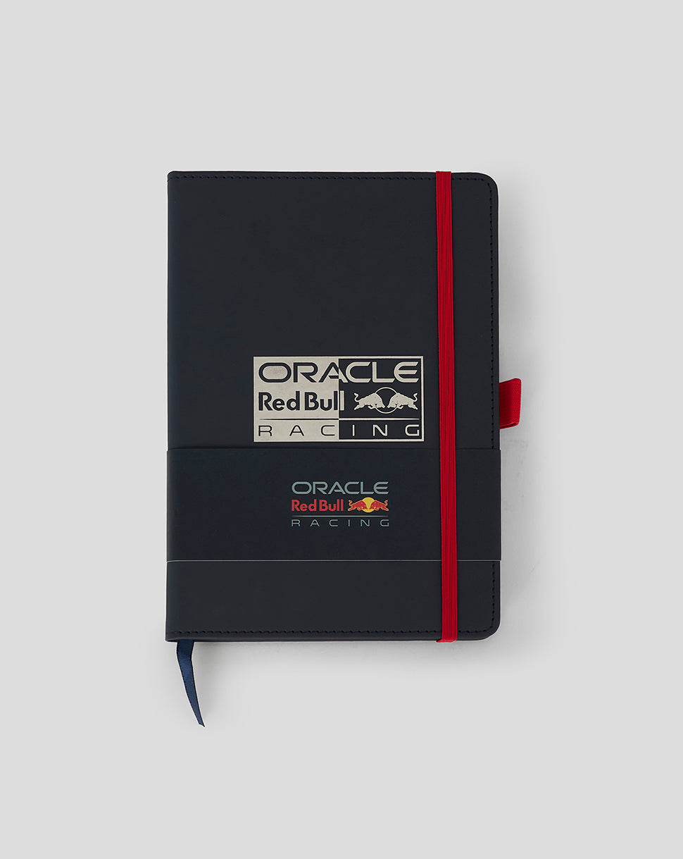 Dark blue Oracle Red Bull Racing notepad with red elastic strap and blue ribbon bookmark, silver foil branding on the cover