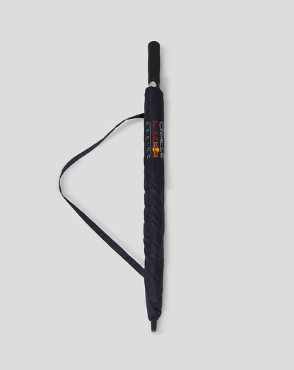 Folded navy Red Bull Racing umbrella with branding on the side strap.