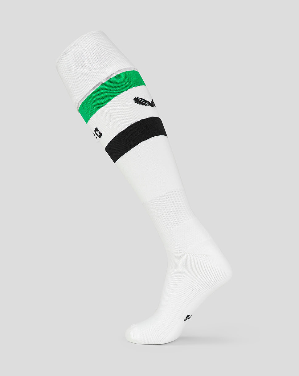 White Mansfield away socks with a green and black striped cuff and small logo near the ankle.