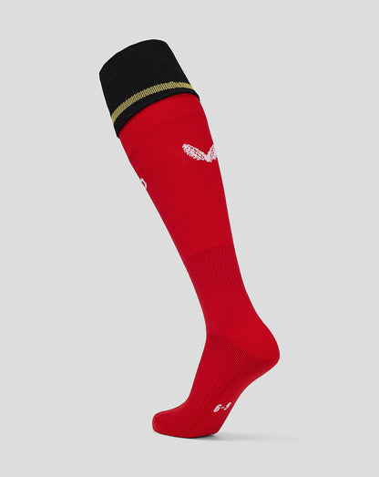 Red Mk Dons adults away sock with black cuff and gold stripe at the top.