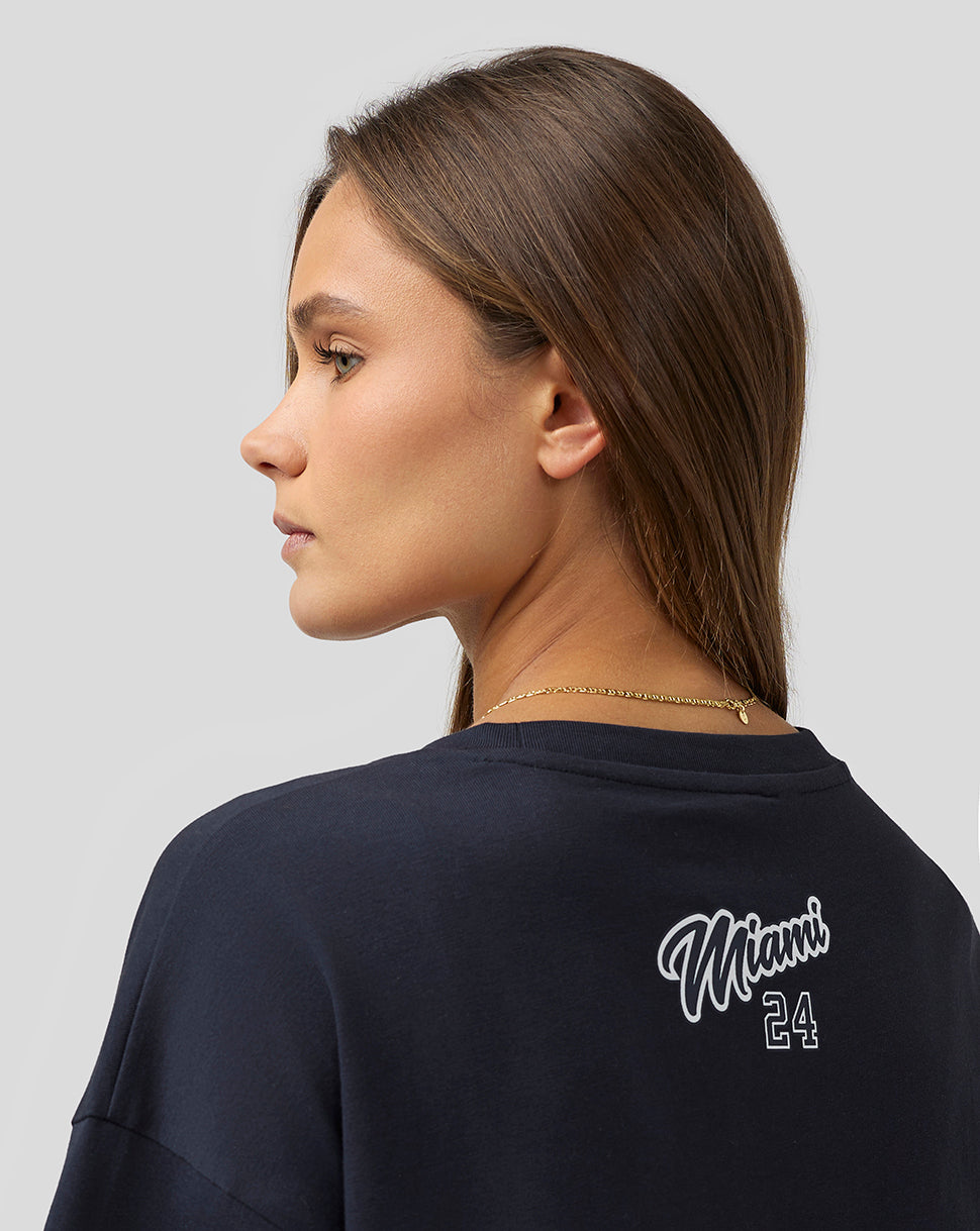 Female model in navy Miami oversized T-shirt back view with Miami 24 graphic