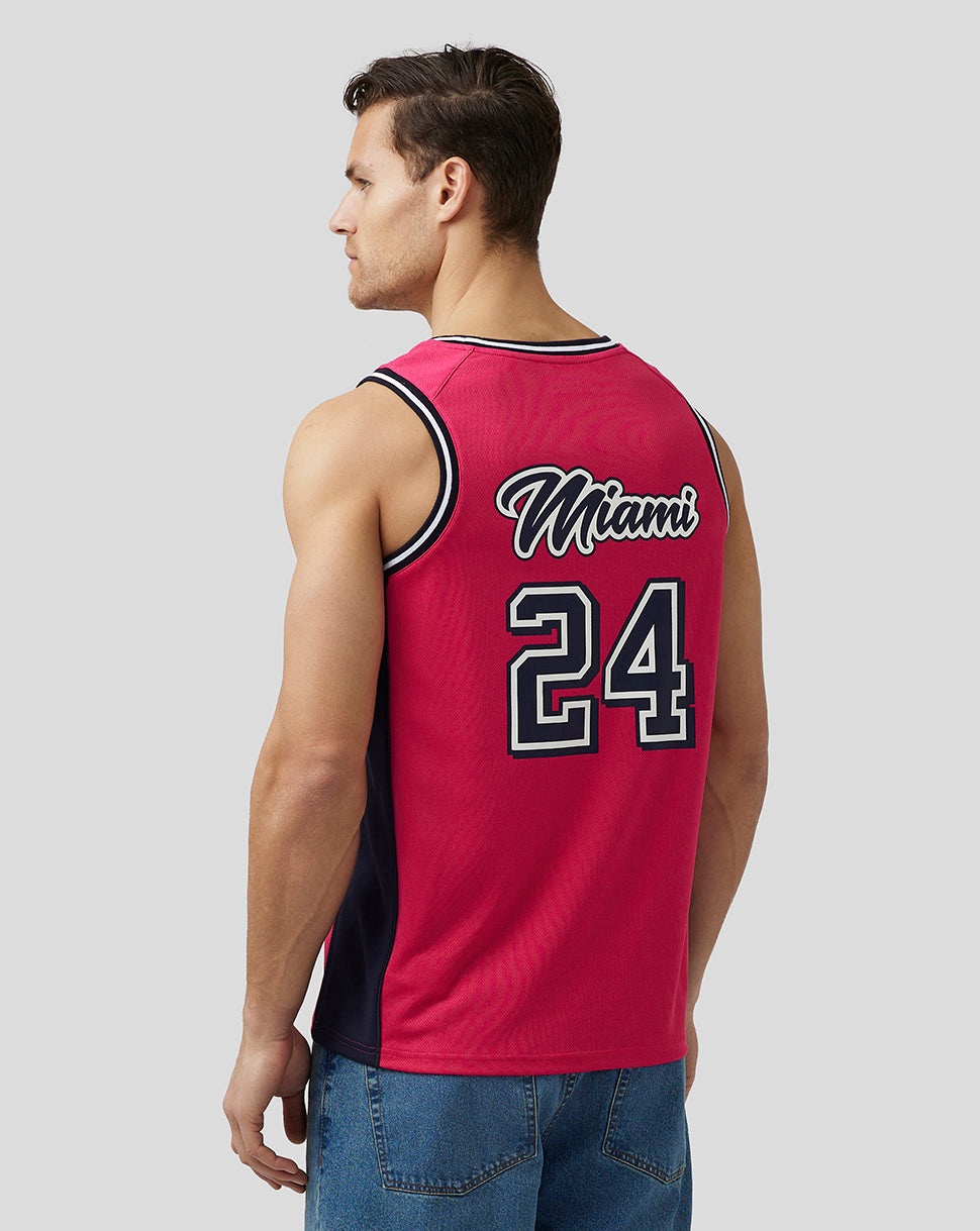 Back view of a male model wearing a pink Miami basketball jersey with the Miami script and 24 on the back
