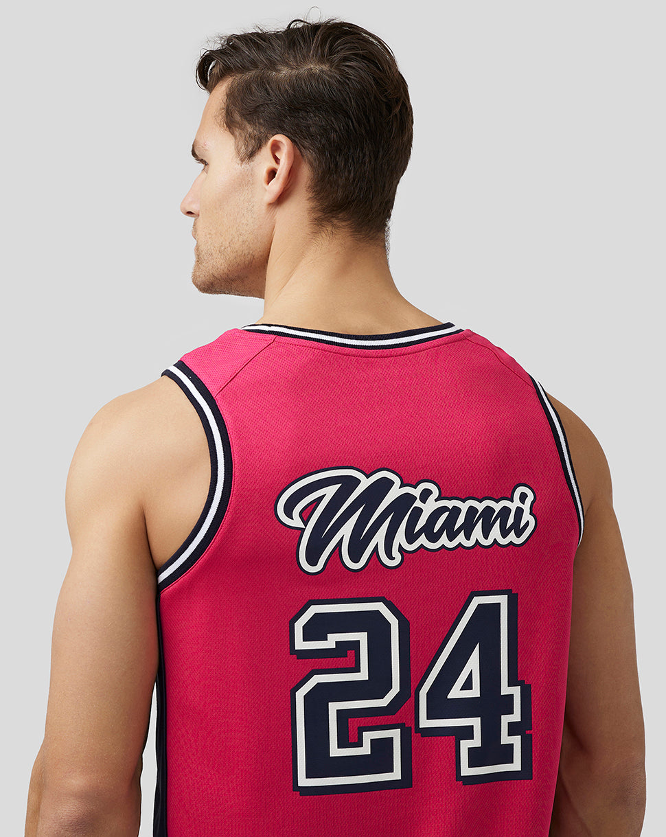 Back view of pink Miami basketball jersey on a model with Miami 24 on the back.