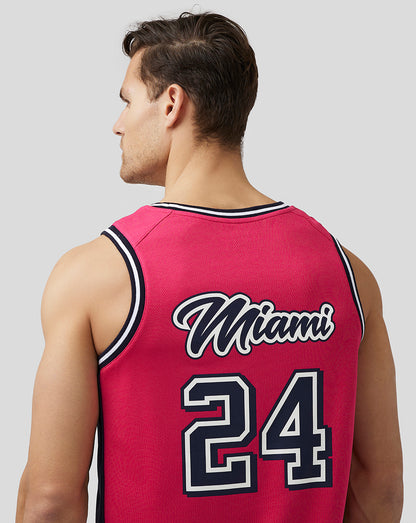 Back view of pink Miami basketball jersey on a model with Miami 24 on the back.