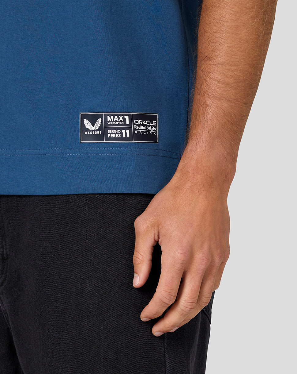 Blue short sleeve T shirt hem with a rectangular patch featuring sponsorship and driver logos.