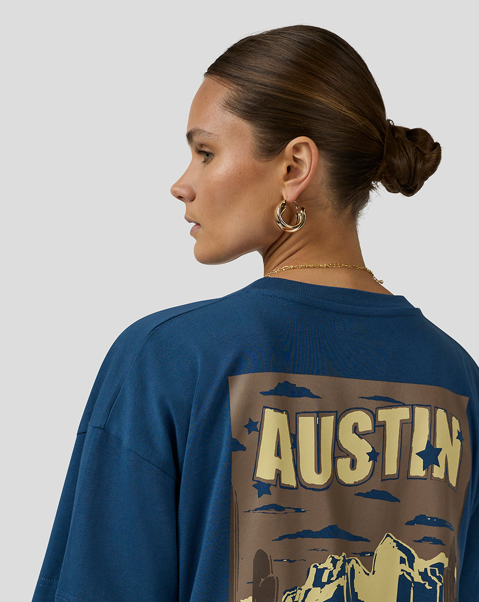Back view of a blue Oracle Red Bull Racing Austin T shirt showing a large Austin graphic across the back