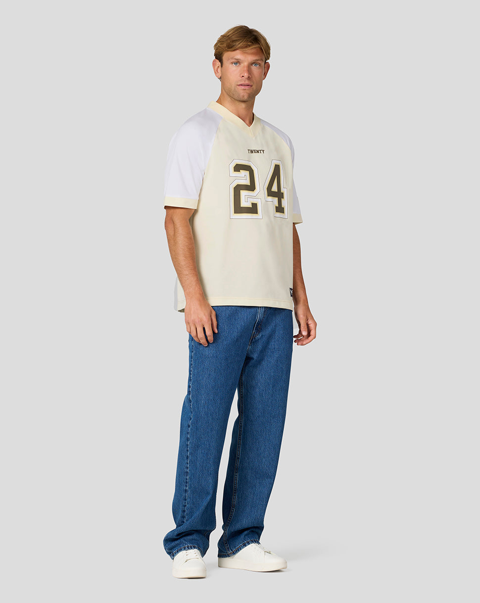 Front view of a male model wearing a cream jersey with white sleeves and a large number 24.