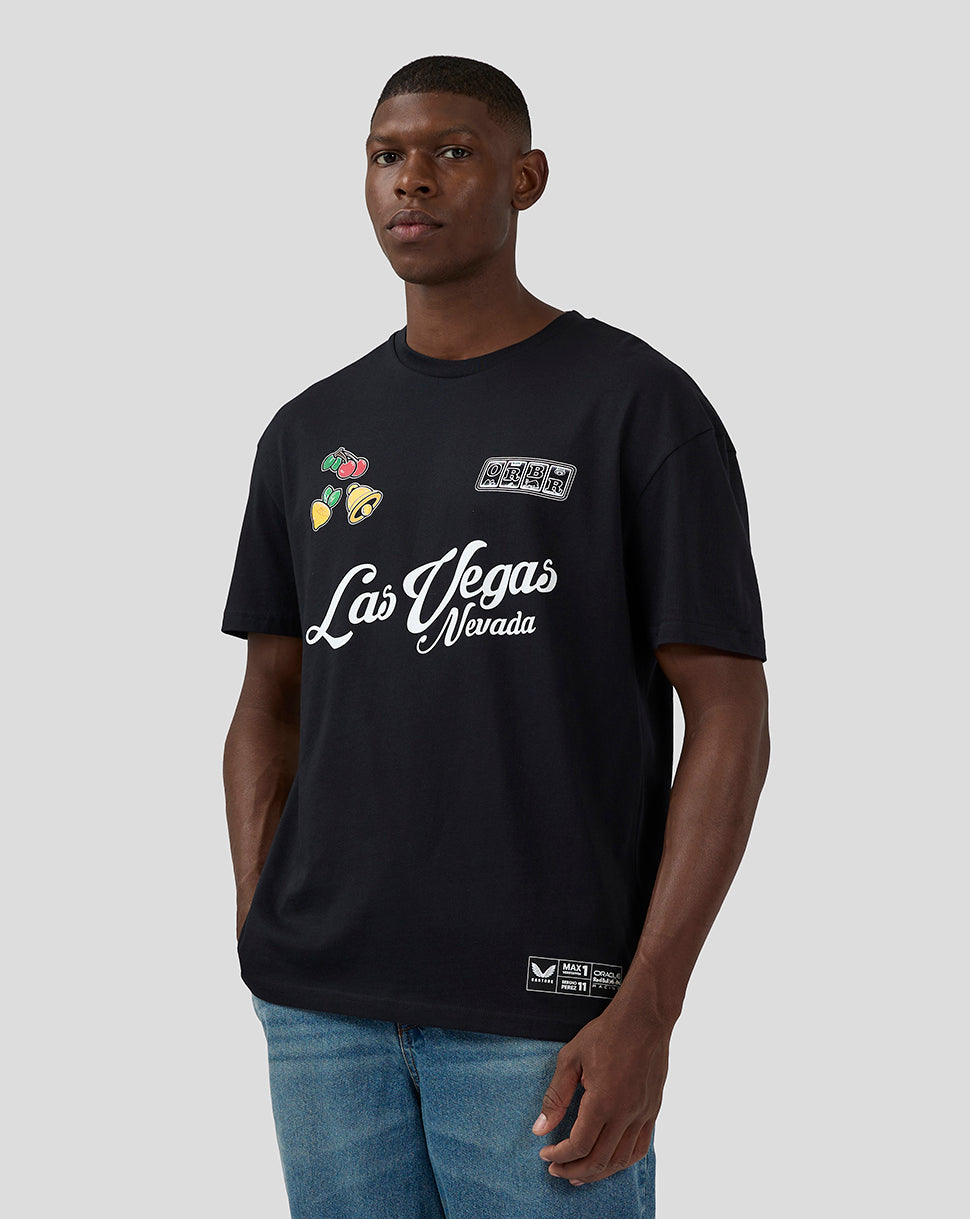 Male model wearing black Oracle Red Bull Racing Las Vegas T Shirt with Las Vegas script and colorful fruit patches on the left chest.
