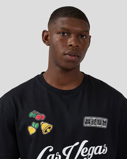 Close up of a black Las Vegas T shirt with colorful fruit graphics and an ORBR patch on the chest.