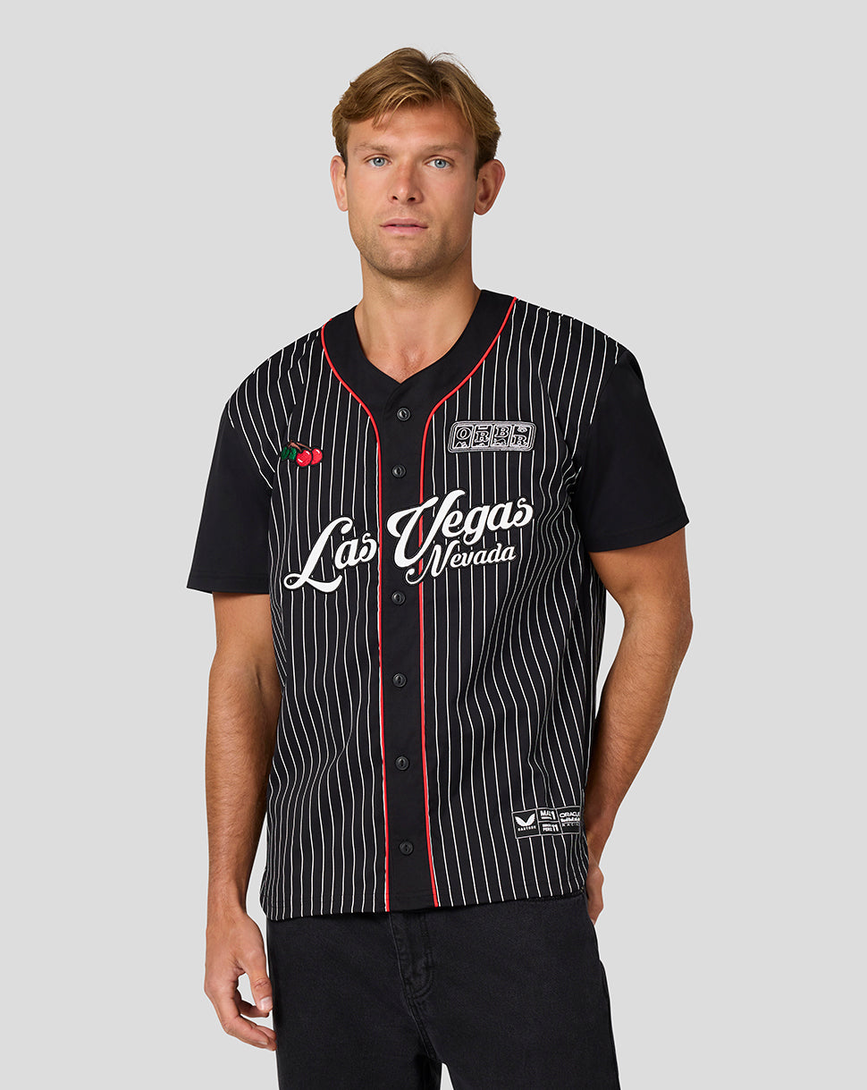 Male model wearing the Las Vegas baseball jersey with black base white pinstripes and Las Vegas Nevada script.