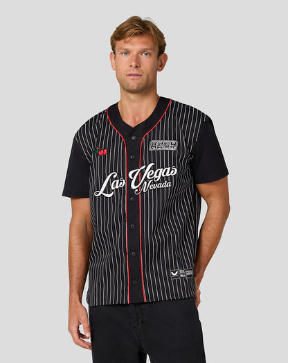 Male model wearing the Las Vegas baseball jersey with black base white pinstripes and Las Vegas Nevada script.