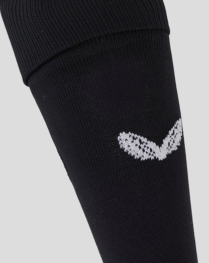 Detail of the white Saracens emblem on the black knee-high sock