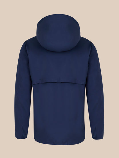 Back view of navy waterproof jacket with hood on, showing a clean silhouette against a beige background