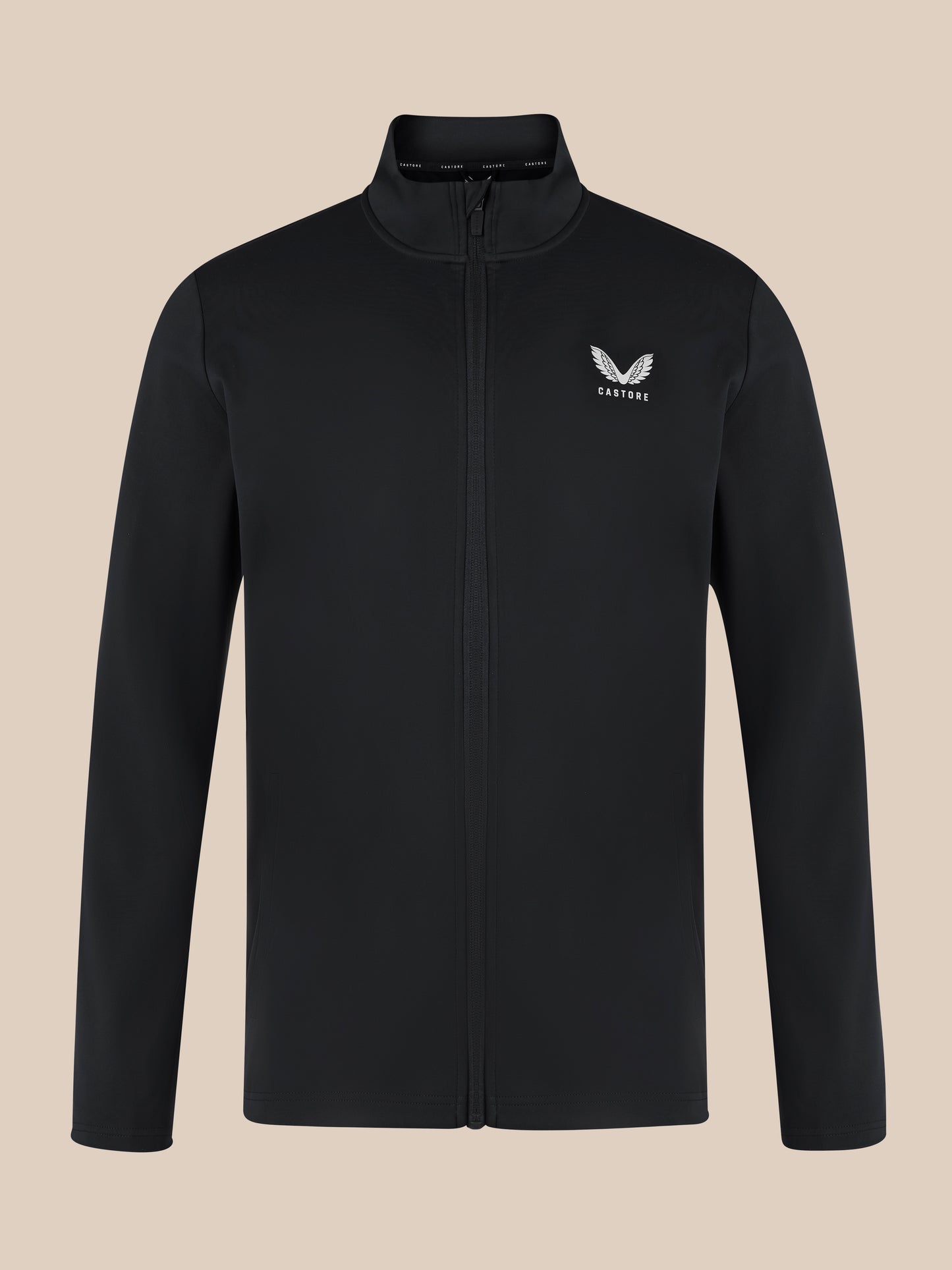 Close up of black unisex softshell jacket with front zipper, high neck collar, and white Castore wing logo on the left chest