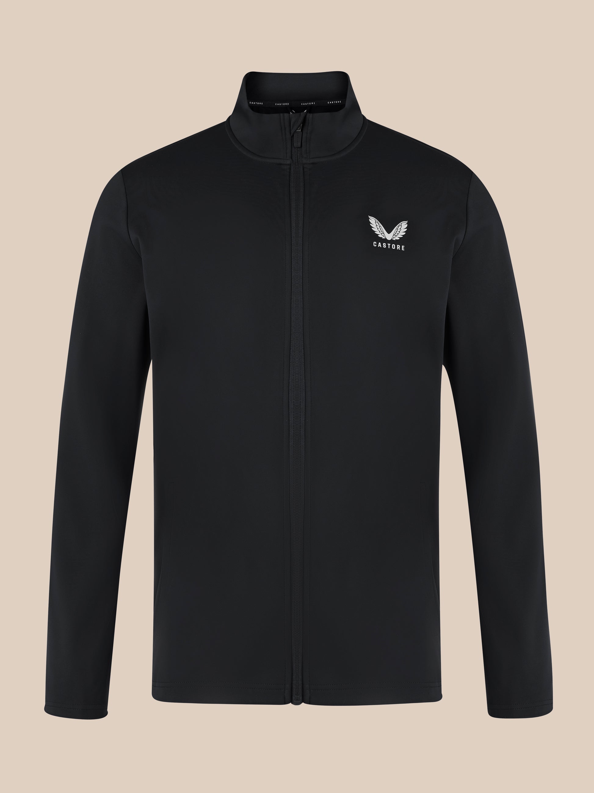 Close up of black unisex softshell jacket with front zipper, high neck collar, and white Castore wing logo on the left chest