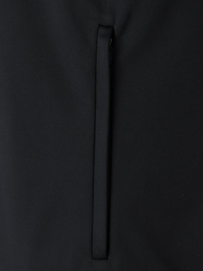Close-up of black softshell jacket fabric with a vertical zipper