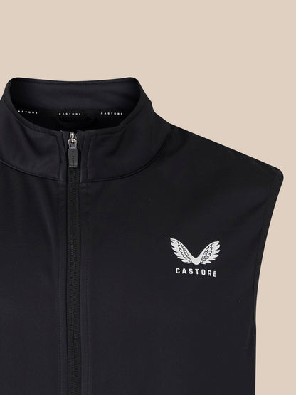 Close-up of black unisex softshell gilet with full-length front zipper and Castore logo on the chest.