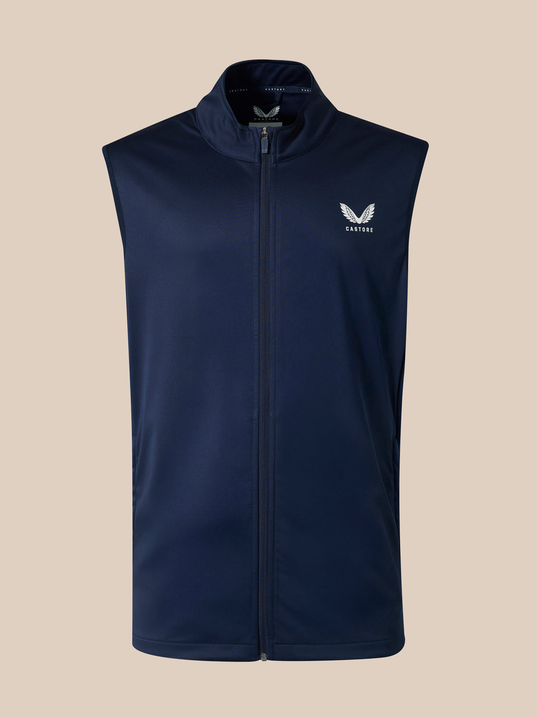 Front view of navy sleeveless softshell gilet with full zipper and small winged emblem on left chest