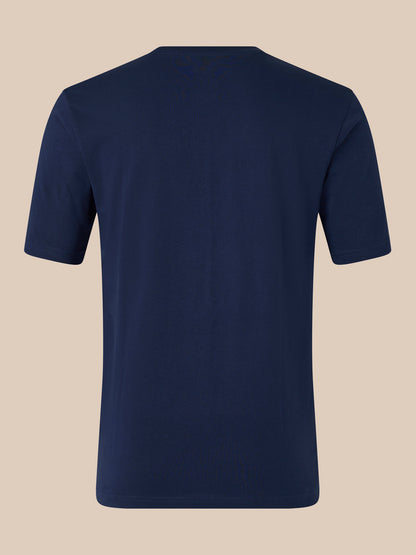 Rear view of a navy unisex short sleeve cotton T shirt showing a plain back without visible graphics