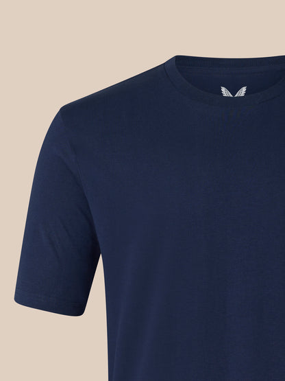 Navy short sleeve cotton T shirt with ribbed collar and white Castore logo on the chest