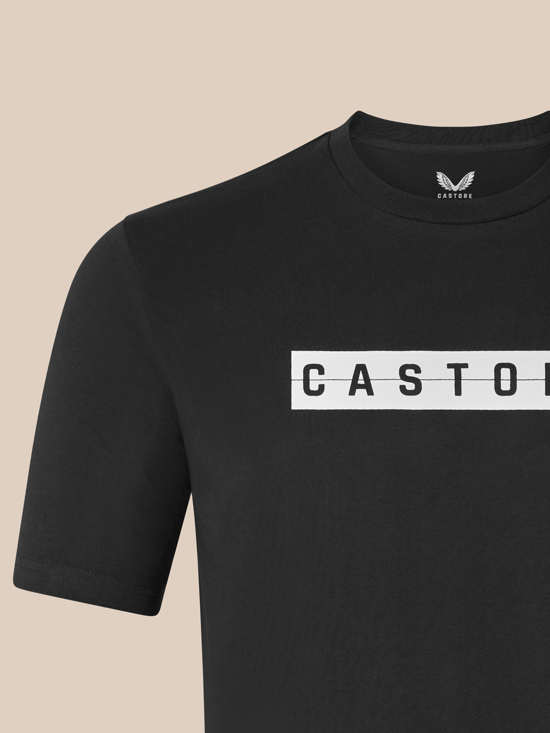 Close-up of black T-shirt front showing the white CASTORE logo across the chest