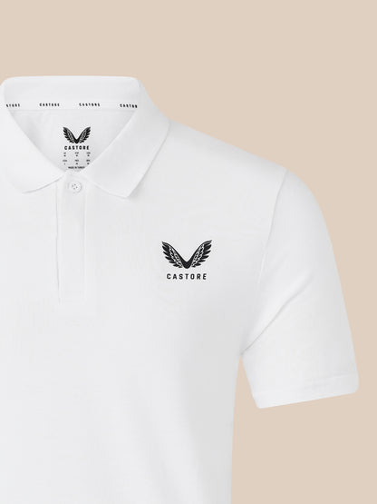 White polo shirt showing CASTORE logo on the chest with a visible collar detail