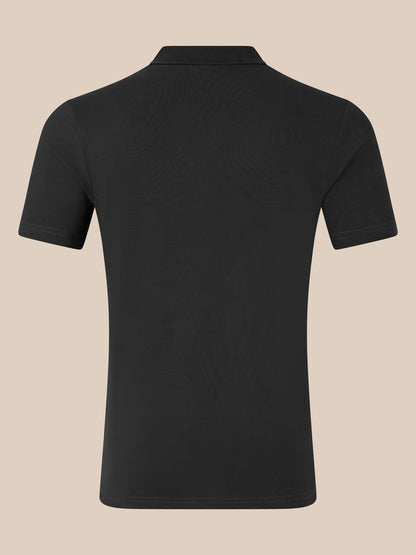 Back view of black unisex cotton polo with short sleeves and classic collar