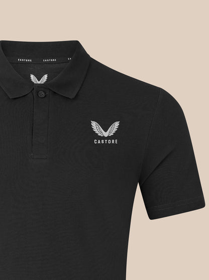 Black unisex short sleeve polo with white embroidered Castore wing logo on the chest and ribbed collar