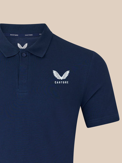 Front close-up of navy polo shirt with embroidered left chest logo and collar detail.
