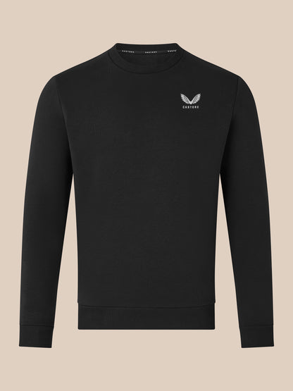 Front view of black crewneck sweatshirt with small white wing logo on left chest