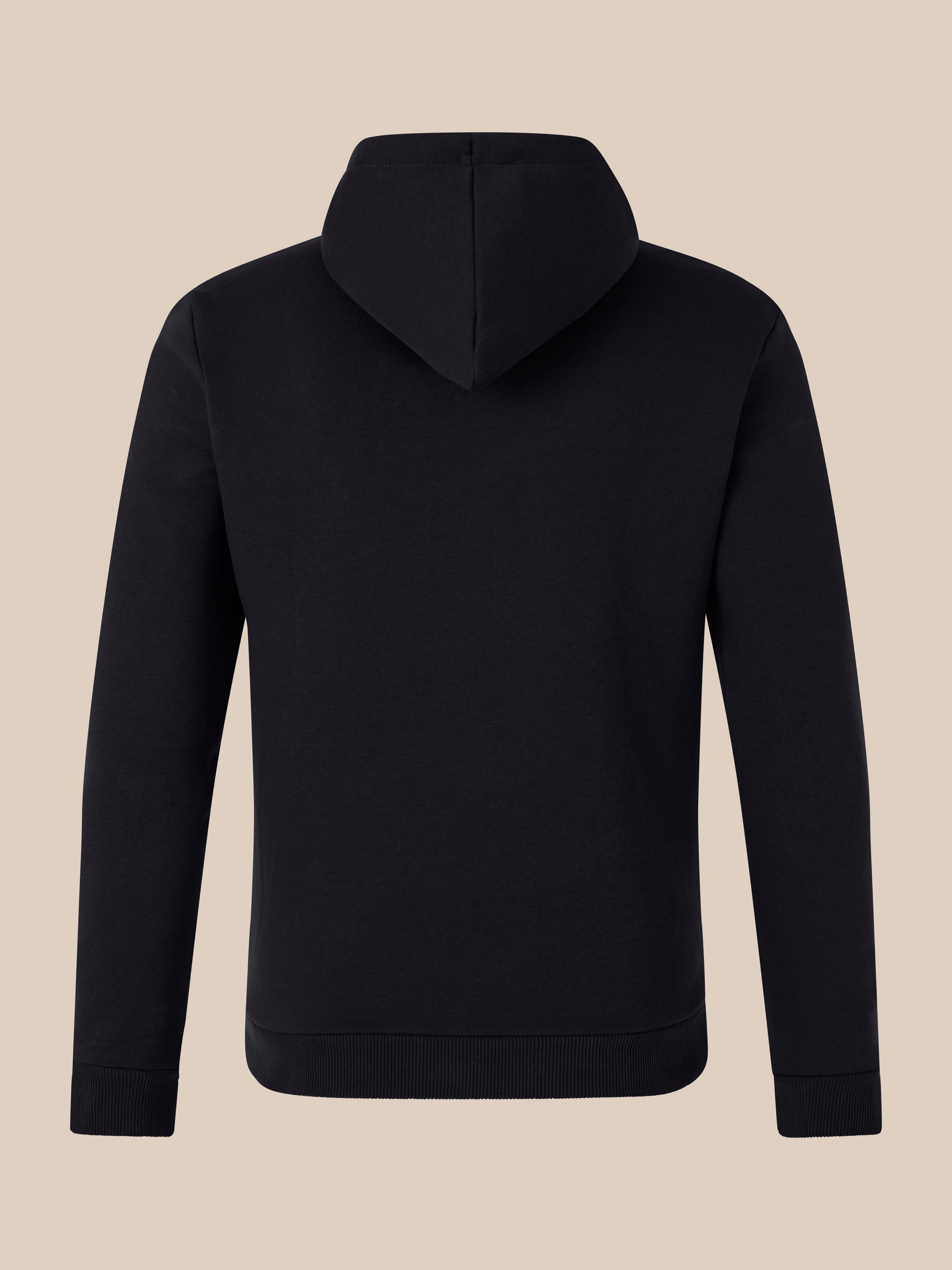 Back view of black hoodie with hood up against a beige background